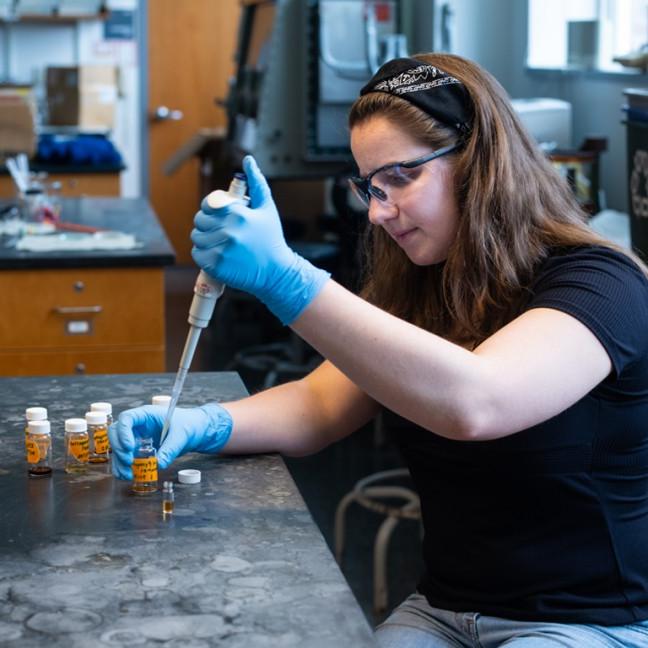 a student works in a chemistry lab